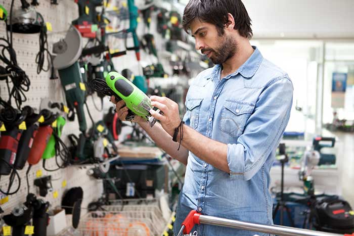 Man looking at hardware tools